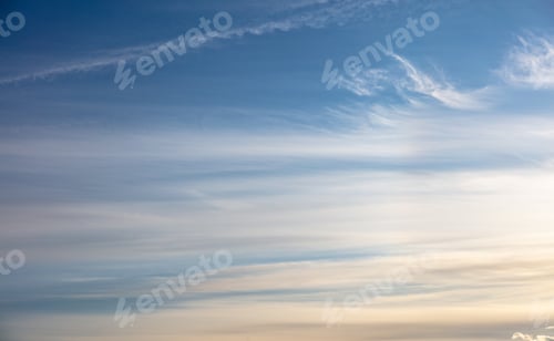 Preview: White clouds on clear blue sky background. Copy space.