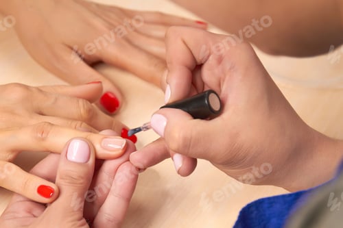 Preview: Applying Red Nail Polish During a Manicure