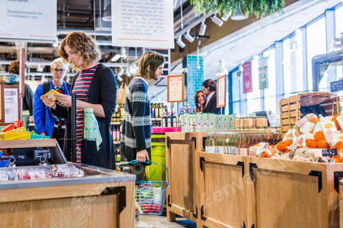 Preview: Shoppers browsing in a vibrant indoor market