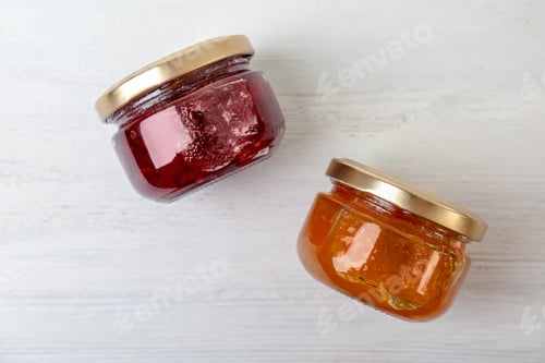 Preview: Two jars with tasty sweet jam on white wooden table