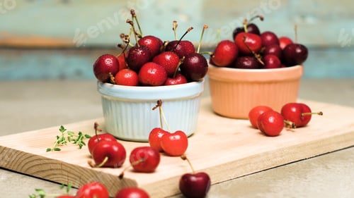 Preview: Red ripe cherries in ceramic bowls