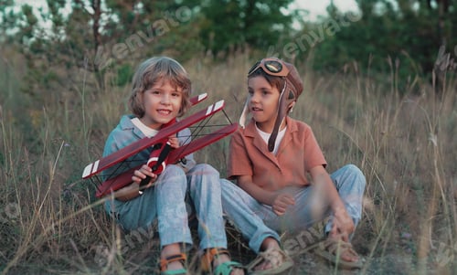 Preview: Smiling curious 5 years old preschool children boys playing, discussing aviation with craft wooden