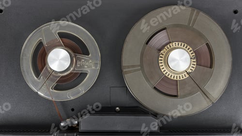 Preview: Reels of old audio tape in tape recorder