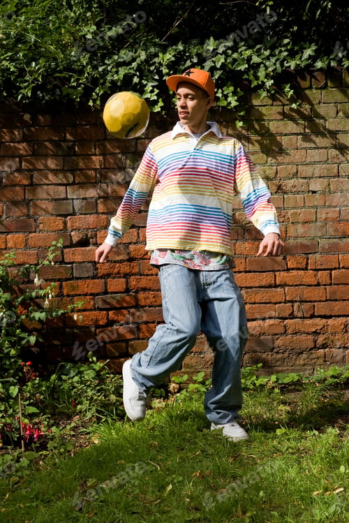 Preview: Mixed Race Teenager playing Football