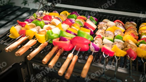 Preview: Chef cooking barbecue with skewers on grilled meat. Very delicious brochette BBQ