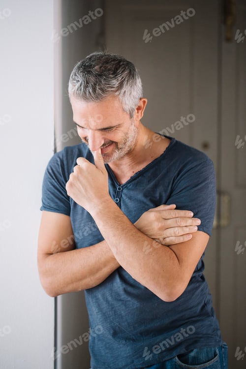 Preview: Portrait of happy mature man at home