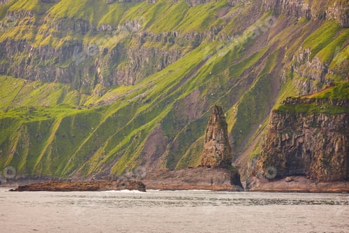 Preview: Green rocky mountain fjord landscape in Faroe islands. Vagar