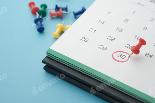 Preview: deadline concept with push pin on calendar date close up