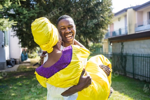 Preview: mid adult couple outdoor house garden having fun together