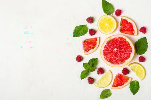 Preview: Fresh Citrus Fruit and Mint Arrangement on White