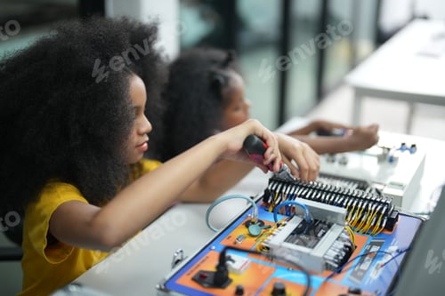Preview: Children using technology, students working with robot for science project in classroom