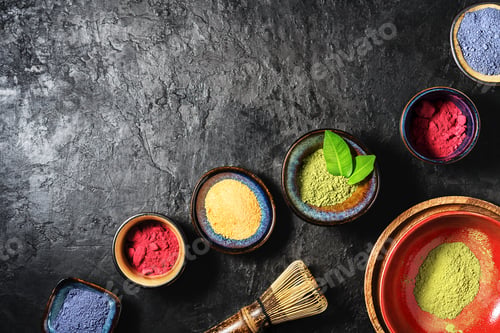 Preview: Various matcha tea powders on a dark concrete background with copy space.