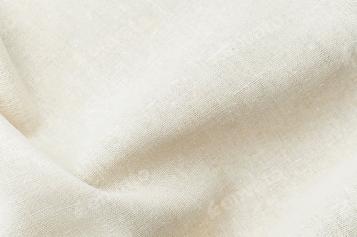 Preview: Natural beige fabric textile with soft folds and texture close up