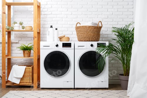 Preview: Modern Laundry Room With White Appliances and Green Plants