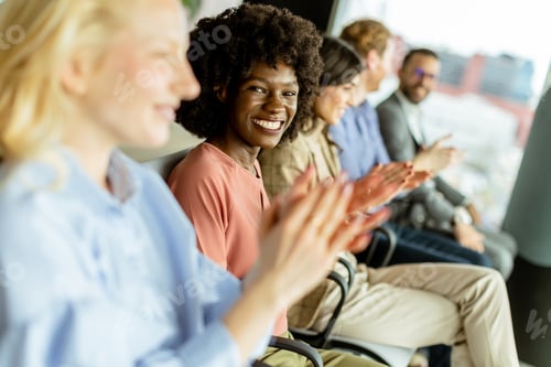 Preview: Energetic applause by a diverse group at a casual indoor event