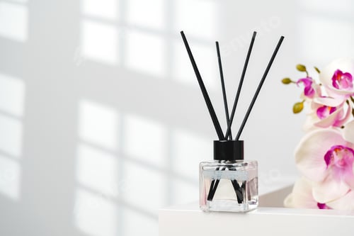 Preview: Elegant Reed Diffusers Beside Blooming Orchids in a Bright Interior Setting