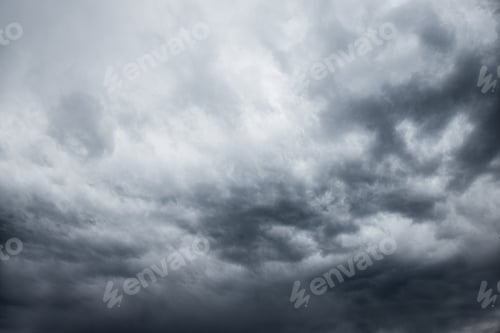 Preview: dark stormy sky, dark clouds, dark sky with converging heavy clouds and violent storm before rain