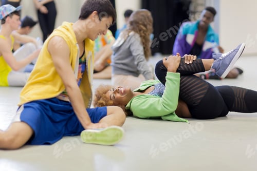 Preview: Dancers stretching together in studio