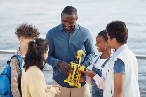 Preview: Diverse Group of Kids in Robotics Class Outdoors