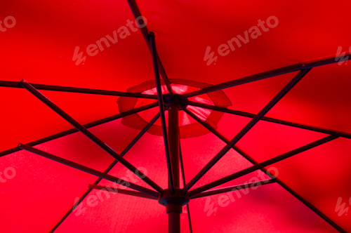Preview: Underneath a red umbrella