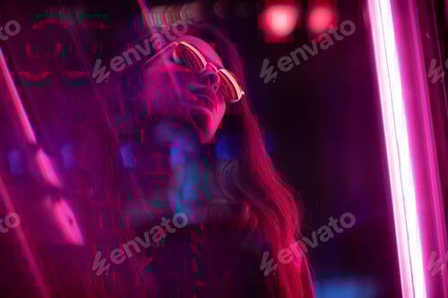 Portrait of young woman with long black hair and red leather jacket