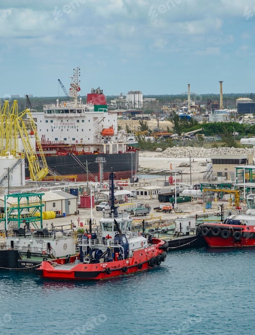 Preview: Containers loading on to a cargo ship on a bright sunny day