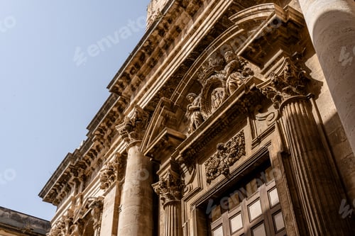 Preview: Ornate baroque church facade with columns and statues in Siracusa