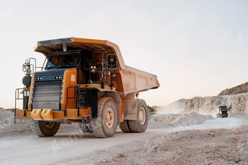 Preview: Mining truck covered with dust, working in an open excavation area