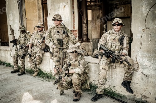 Preview: Soldier in full US MARSOC armed with assault rifle run through the abandoned building. Military