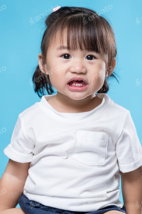 Preview: Little girl showing her teeth