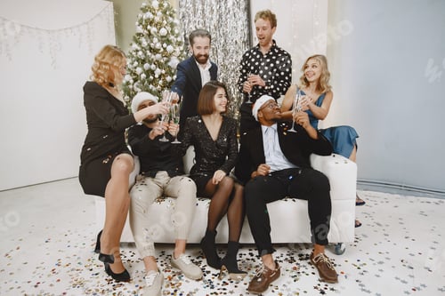 Preview: International people having fun in a party decorated room