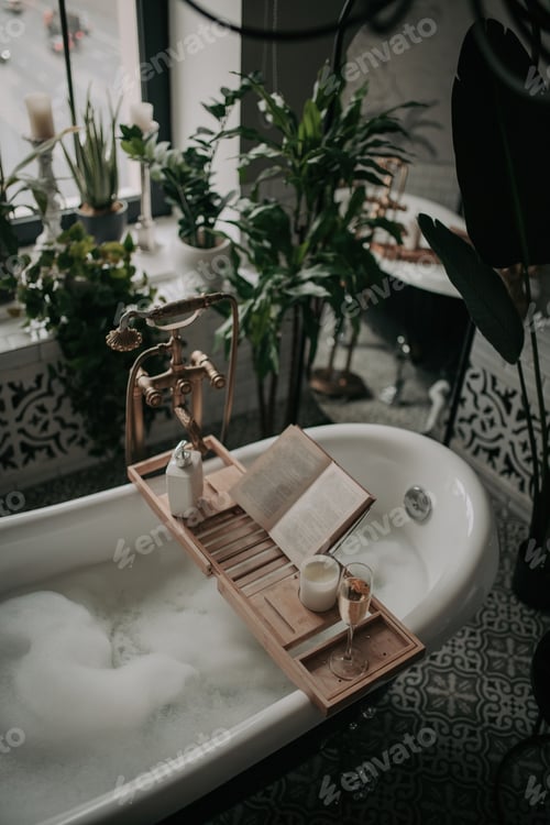 Preview: Luxury interior of eco style modern bathroom with oval bathtub and book on bamboo wood tray