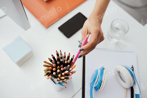 Preview: Designer taking a colored pencil