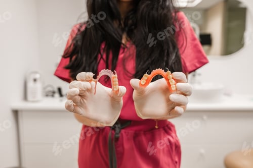 Preview: Dentist presenting partial dentures for oral health