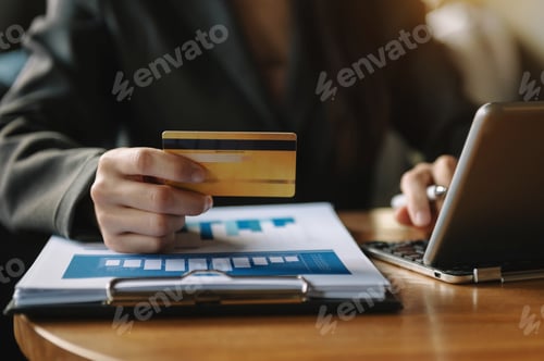 Preview: hand using tablet ,laptop, and holding mobile with credit card online banking payment shopping