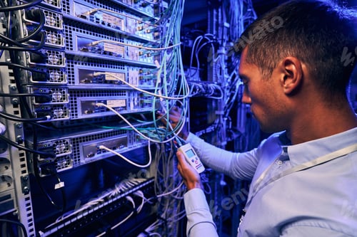 Preview: Maintenance technician performing diagnostic test of optical networks