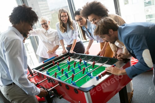 Preview: Multiracial people having fun in office room, excited diverse employees enjoying activity at work