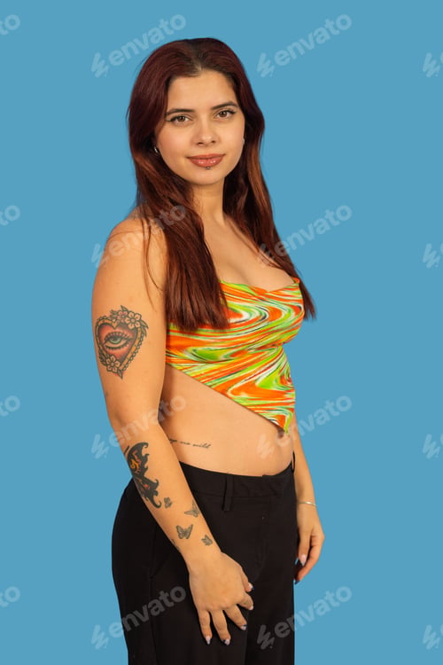 Preview: Young woman with tattoos wearing colorful top