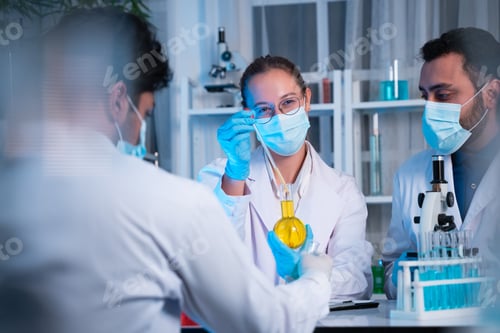 Preview: A group of young scientists are conducting experiments in the lab using a microscope.