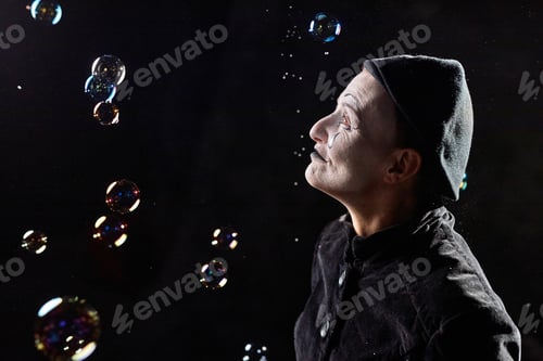 Preview: Mime looking at soap bubbles