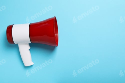 Preview: Red bullhorn on blue background, space for text