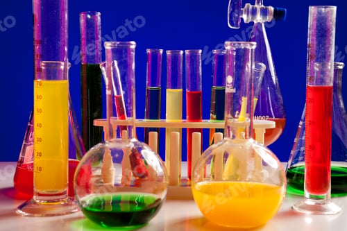 Preview: Chemistry equipment set on a table over blue background