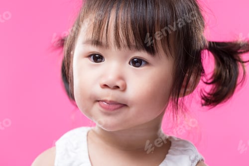 Preview: Adorable baby girl over pink background