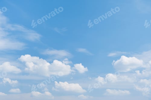 Preview: Sky. Blue sky with white clouds background. Curly clouds on a sunny summer day. Light cloudy. Good