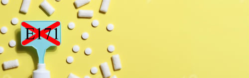 Preview: Titanium dioxide, E171, dangerous additive concept. gum, pills, toothpaste or cream and sign with E