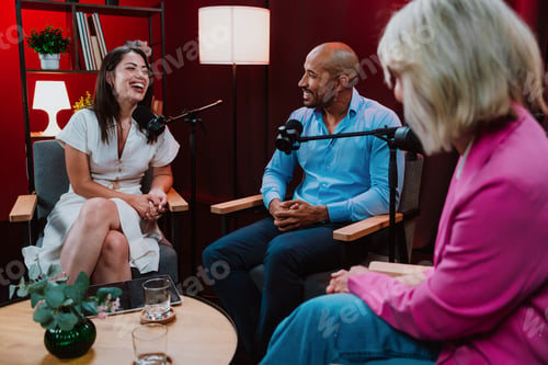 Preview: Content creators broadcasting live podcast interview using microphones