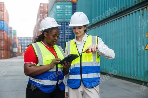 Preview: Female supervisors inspecting container yard operations
