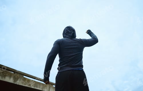 Preview: Sport, success and fitness man celebrating win, achievement and victory after outdoor training agai
