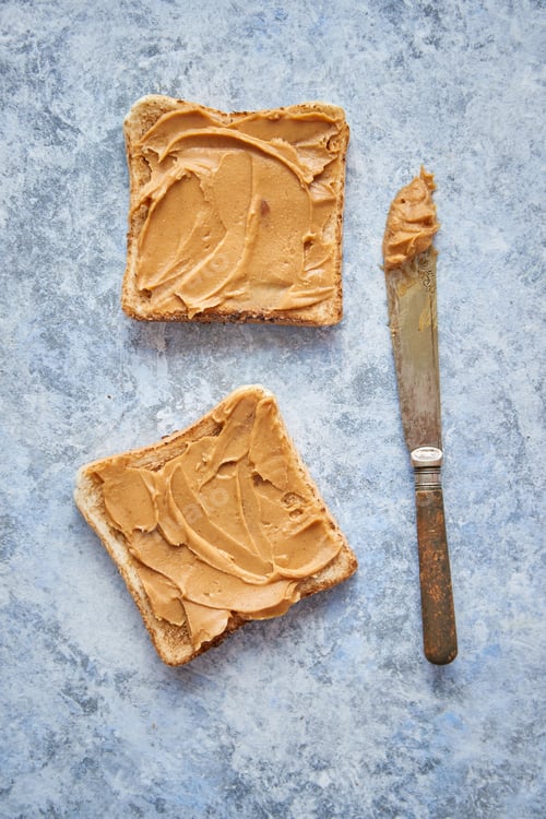 Preview: Two tasty peanut butter toasts placed on stone table