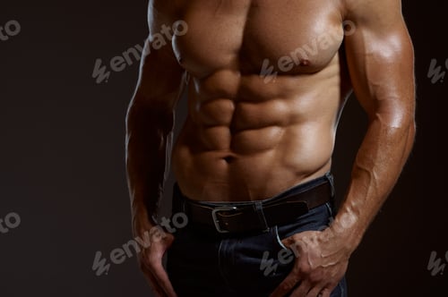 Preview: Male muscular athlete poses in studio
